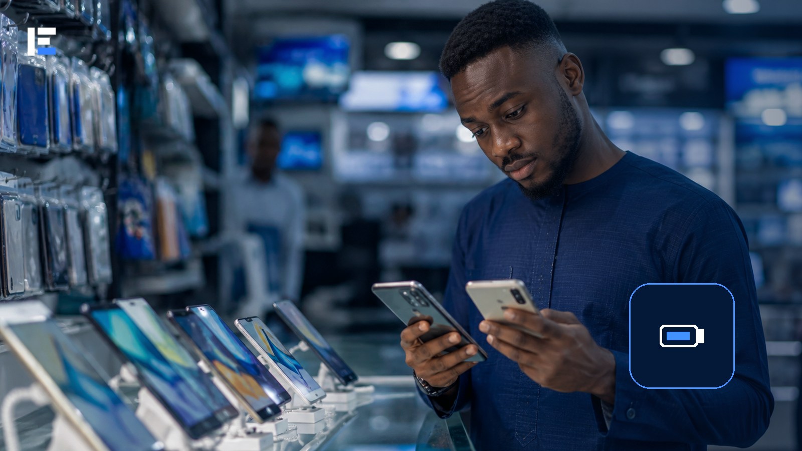 A Nigerian shopper comparing portable charging products in an electronics store