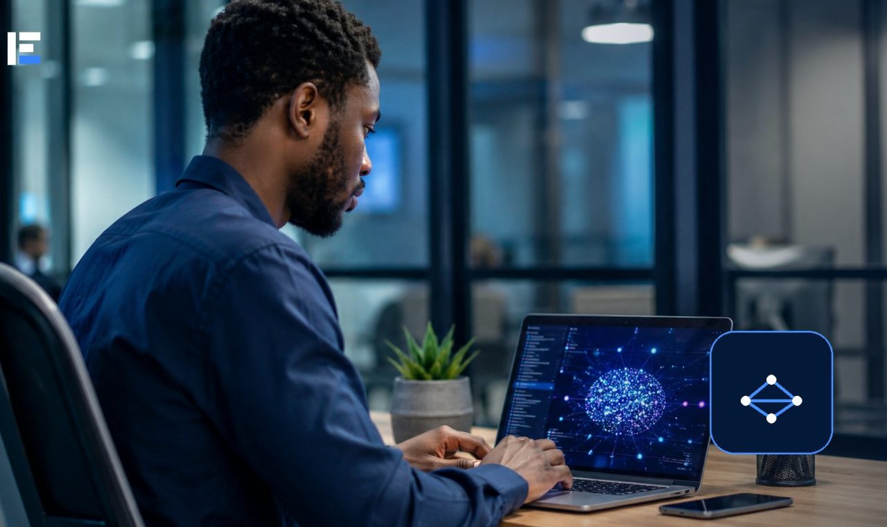 A Nigerian technology professional working with an artificial intelligence system on a laptop