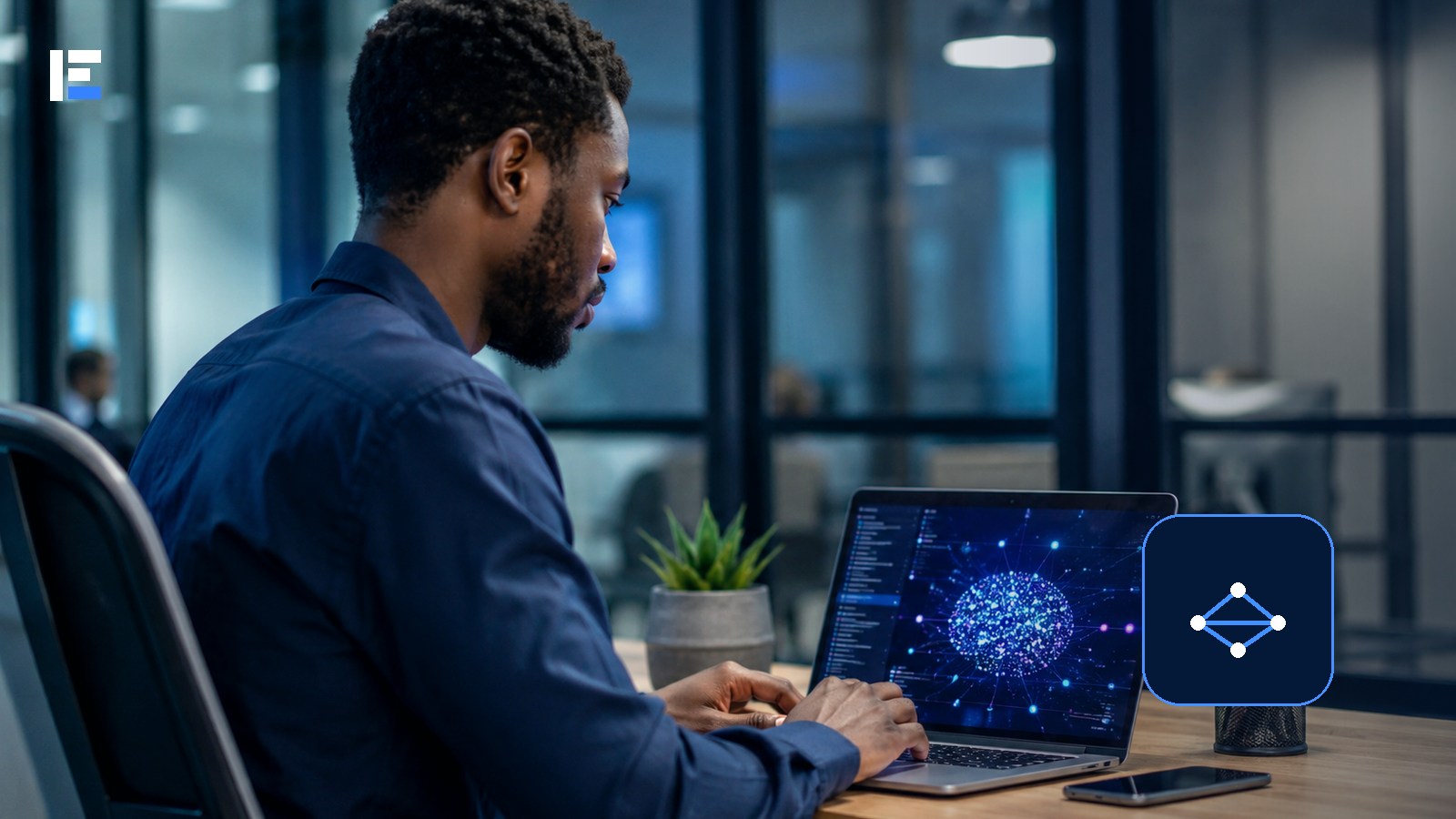 A Nigerian technology professional working with an artificial intelligence system on a laptop