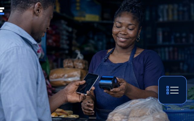A Nigerian small-business owner reviewing software options during a digital payment