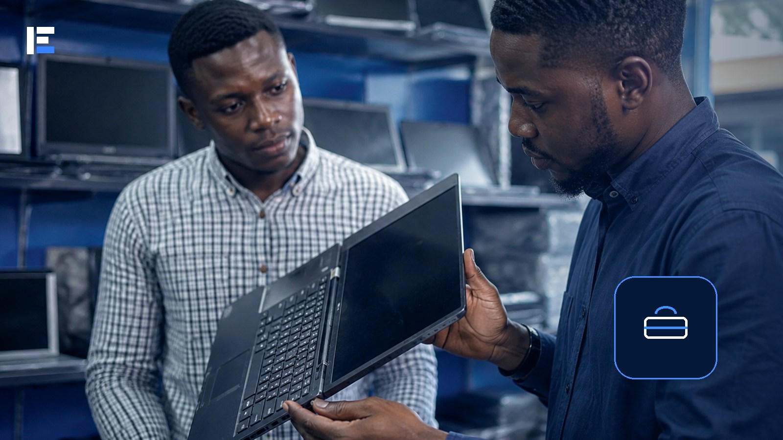 Two African professionals inspecting a laptop while checking a remote job offer